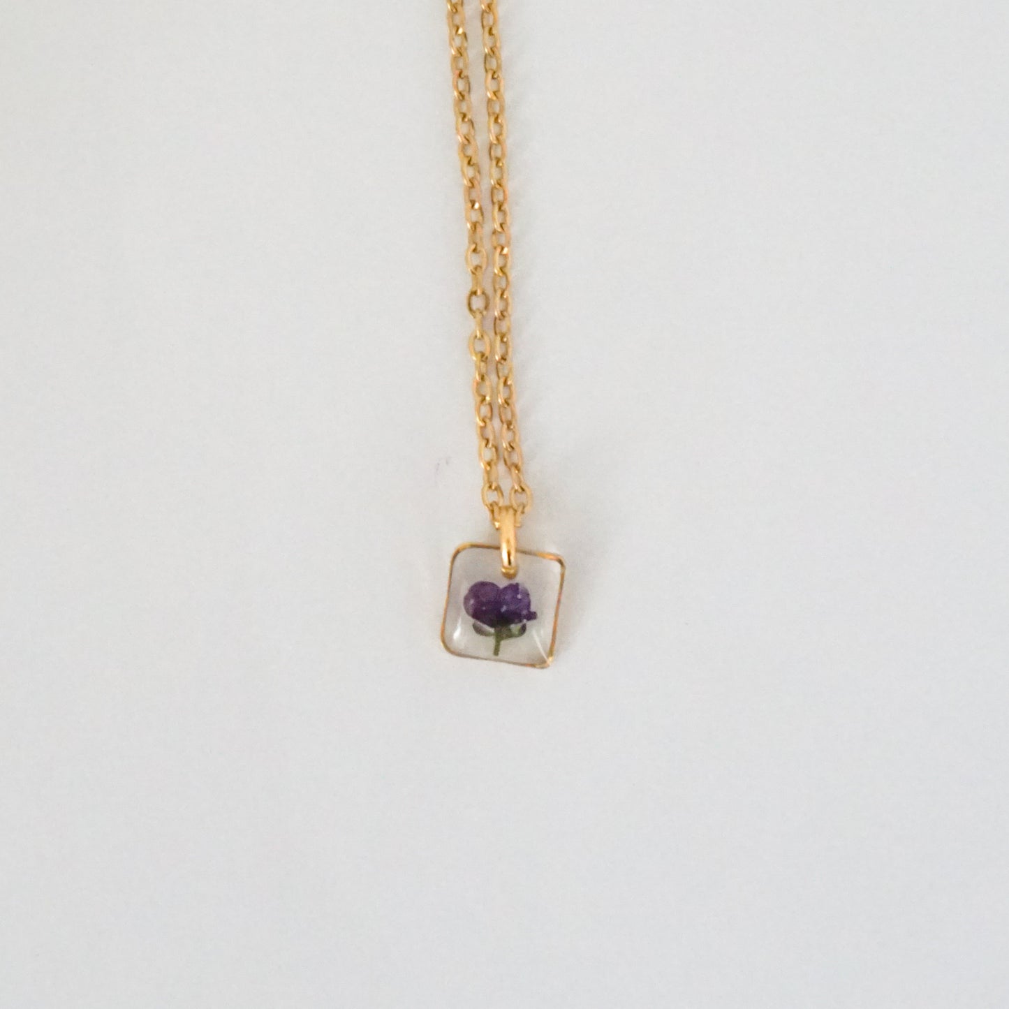 Dije panalillo morado