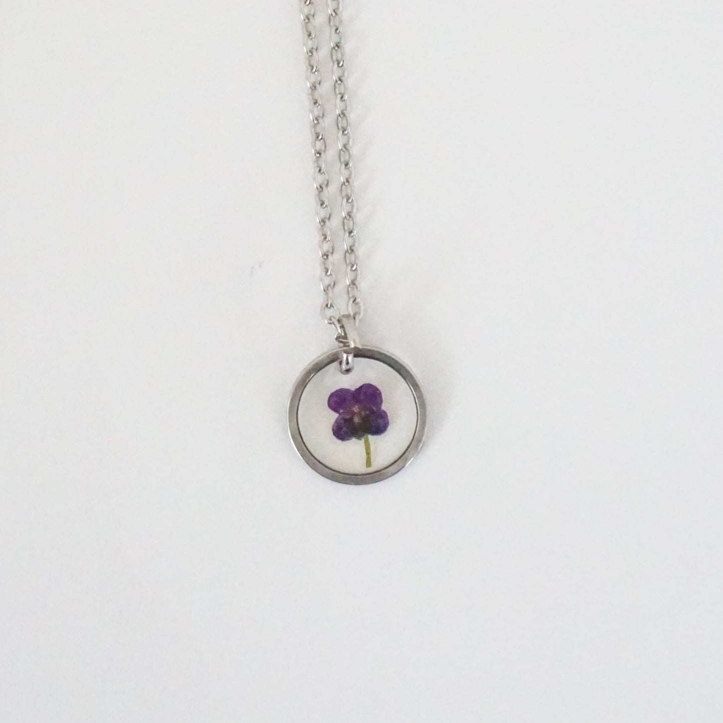 Dije panalillo morado