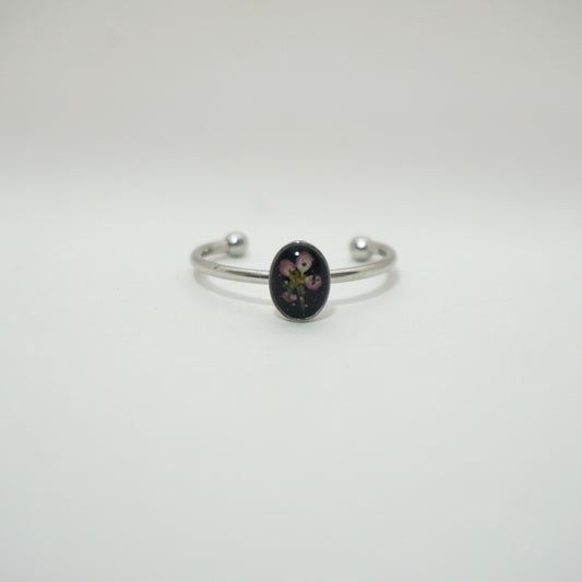 Anillo ajustable panalillo rosa fondo negro