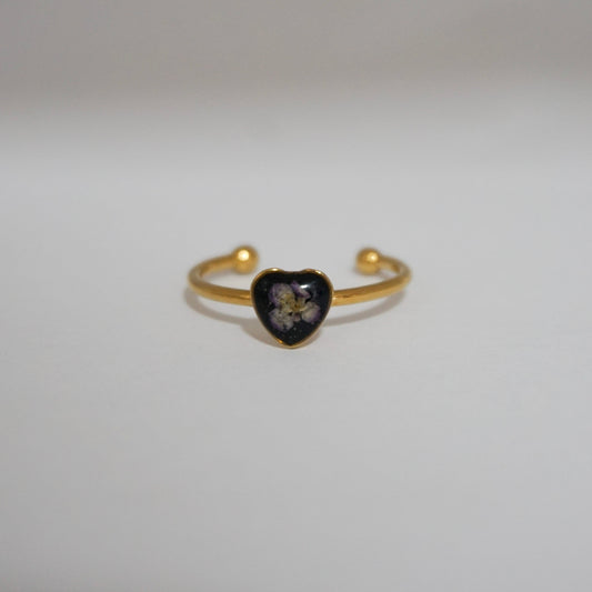 Anillo ajustable panalillo lila fondo negro