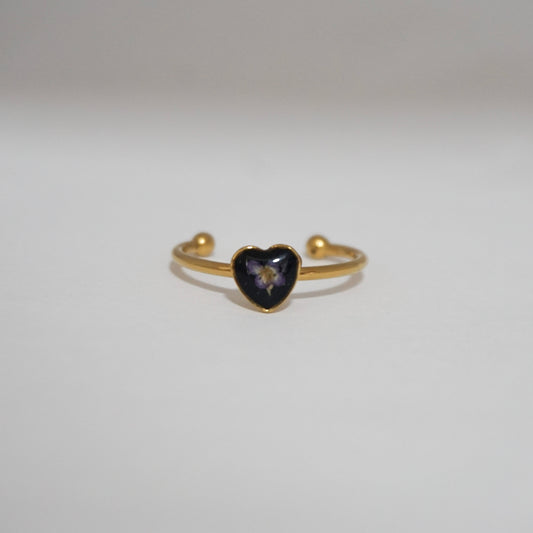 Anillo ajustable panalillo morado fondo negro